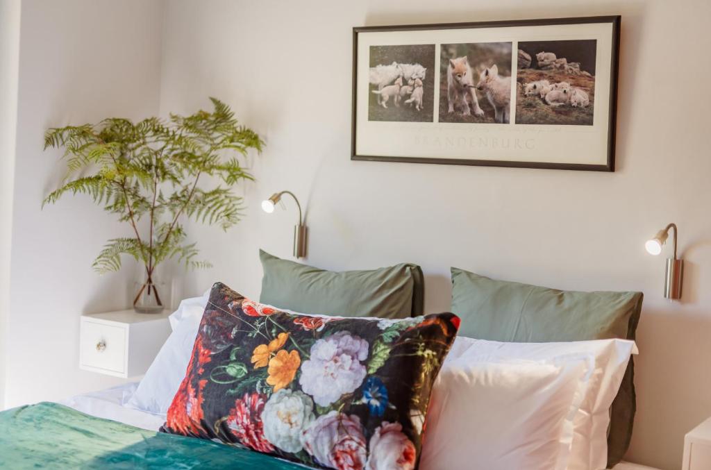 a bedroom with a bed with a pillow on it at Central Stellenbosch Apartment with secure parking in Stellenbosch