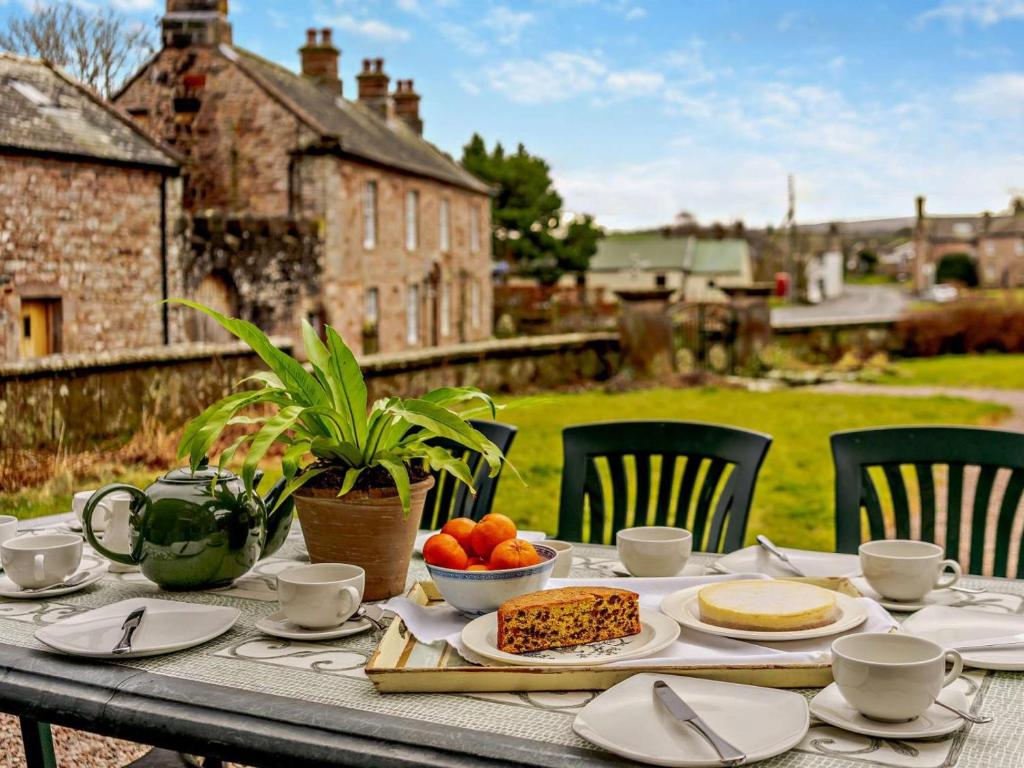 a table with a plate of food on it at 4 Bed in Penrith oc-94247 in Greystoke
