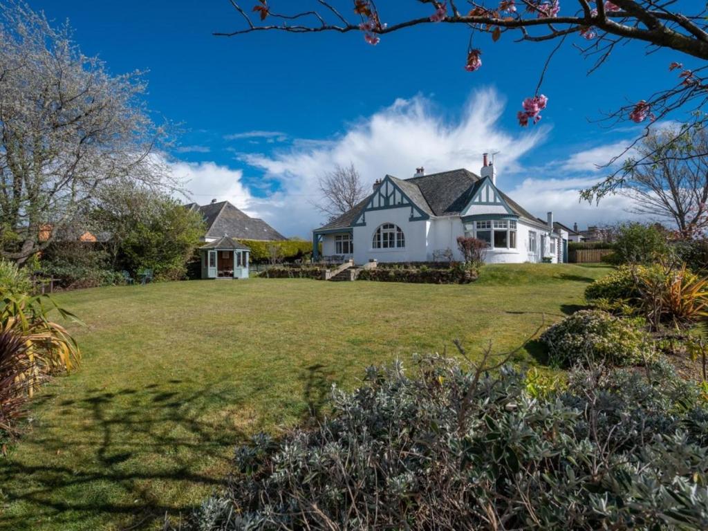 a white house with a large yard at 3 Bed in Gullane oc-96141 in Gullane