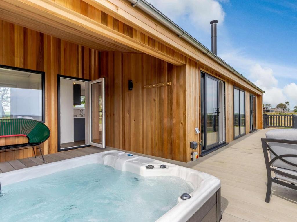 a hot tub on the deck of a house at 2 Bed in Anstruther oc-83173 in Anstruther