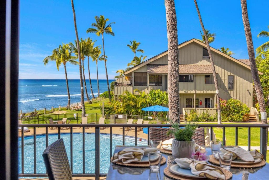 a view of the ocean from the balcony of a resort at Kahana Village 9 · KHV 9 2BR Oceanfront Condo w Panoramic Maui in Lahaina