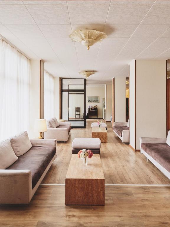 a living room with a couch and a coffee table at Ilgo Hotel in Perugia