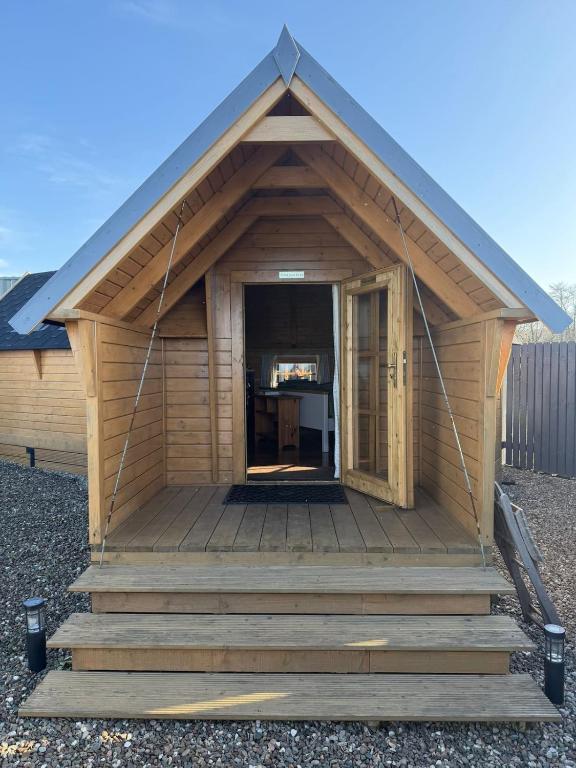 a small building with a porch and stairs at The Nook Cardross in Cardross