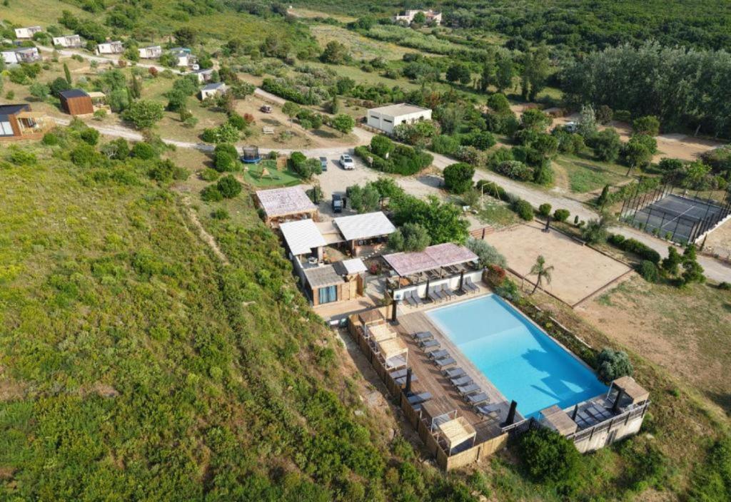 an aerial view of a house with a swimming pool at Vista Mare , Cap corse in Meria