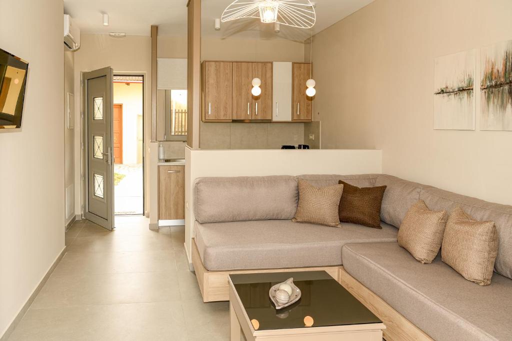 a living room with a couch and a table at Abelia Abode Apt in Kavros