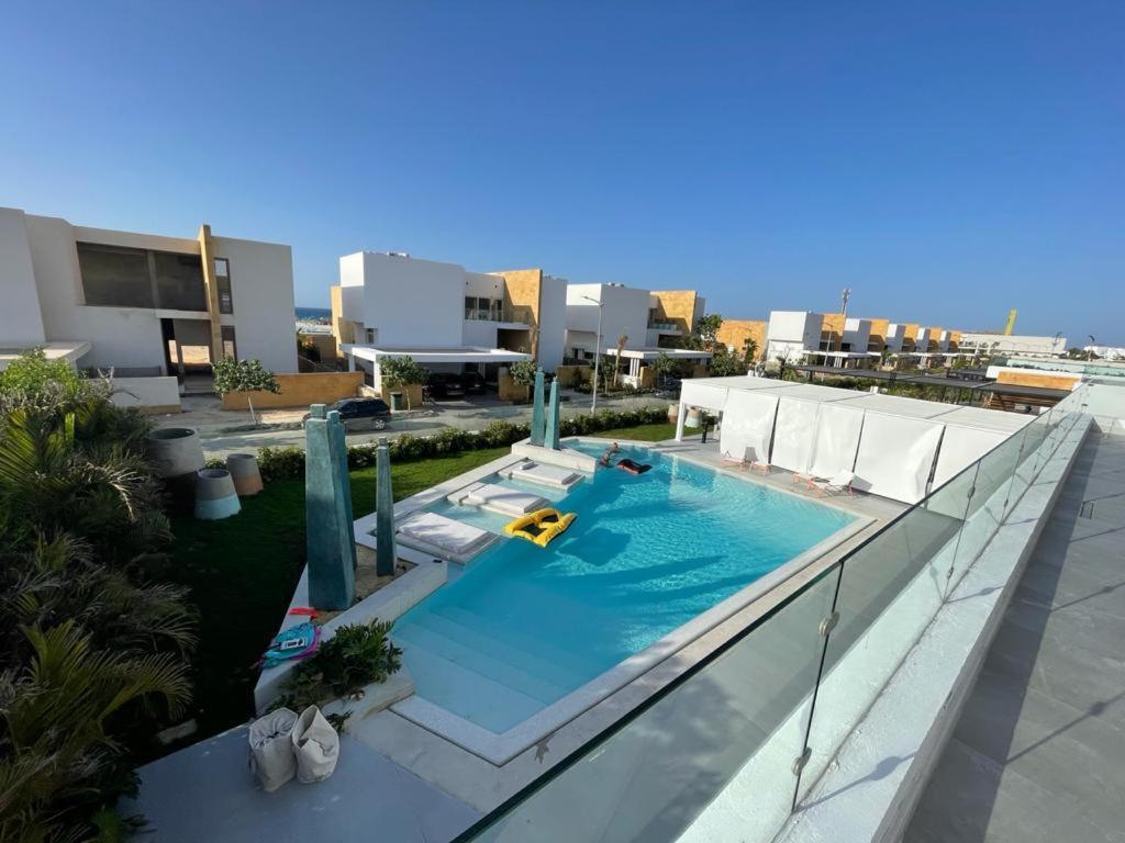 an image of a swimming pool on the roof of a building at Seashell 2nd row sea Villa in El Alamein