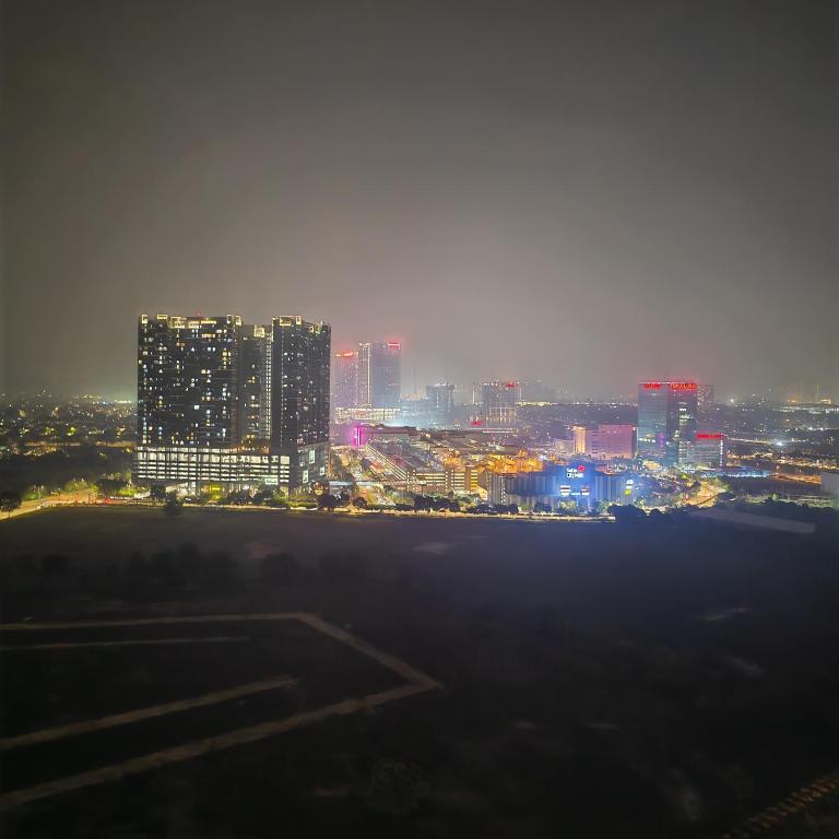 a view of a city skyline at night at Eduscentral Stanford, Setia Alam in Shah Alam