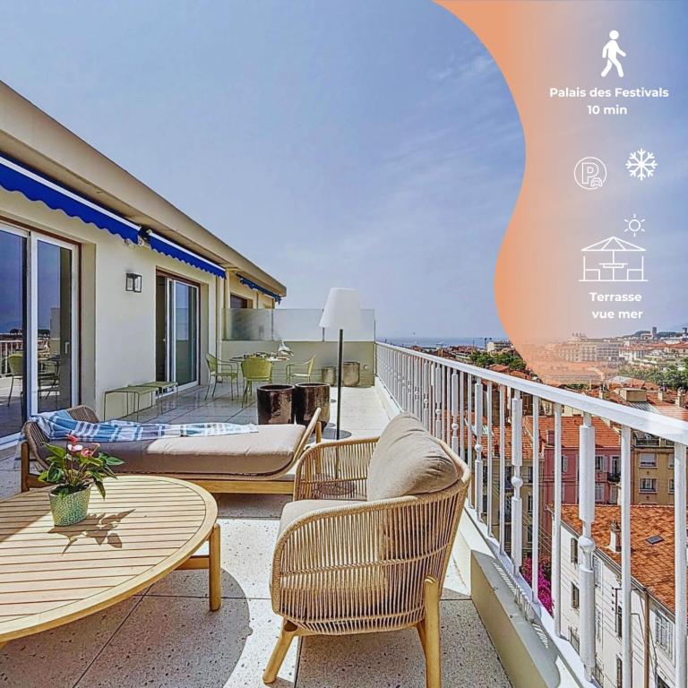 a balcony with furniture and a view of the ocean at Sea View Terrace Penthouse Garage Walk to the Palais in Cannes