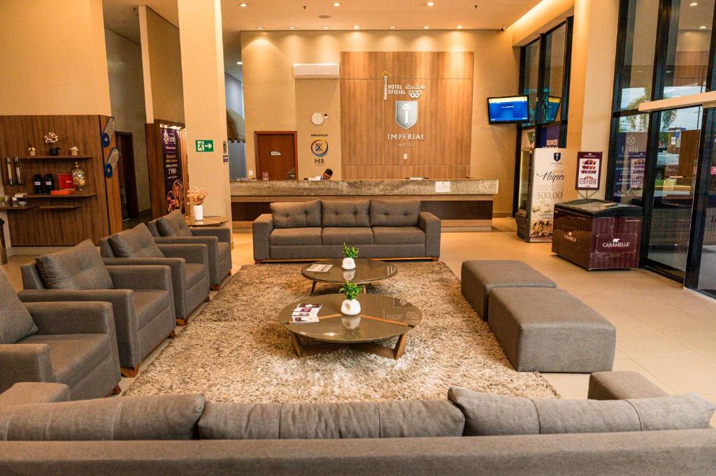 a lobby with couches and tables in a store at Imperial Hotel in Imperatriz