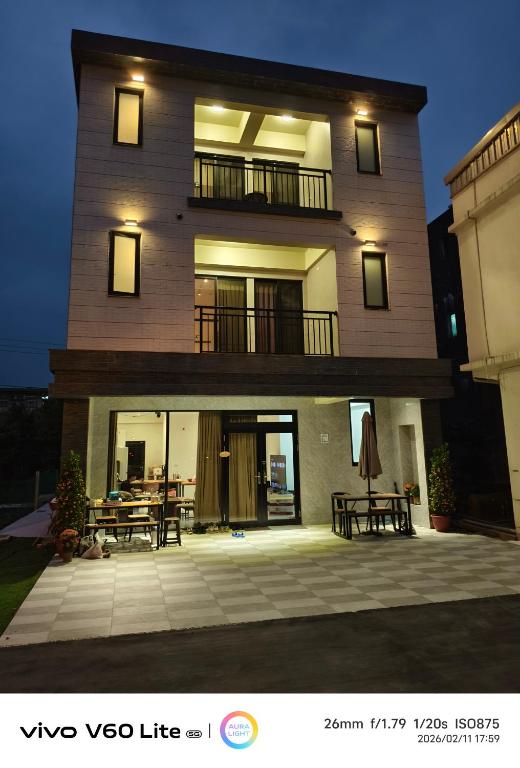 a tall building with a patio in front of it at Fu Qiaoqing Travel電梯獨棟 in Wujie