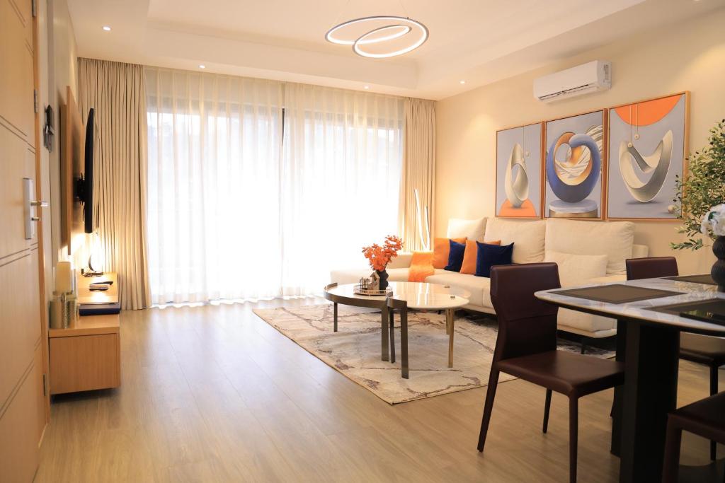 a living room with a couch and a table at Abrish Hotel and Apartment in Kampala