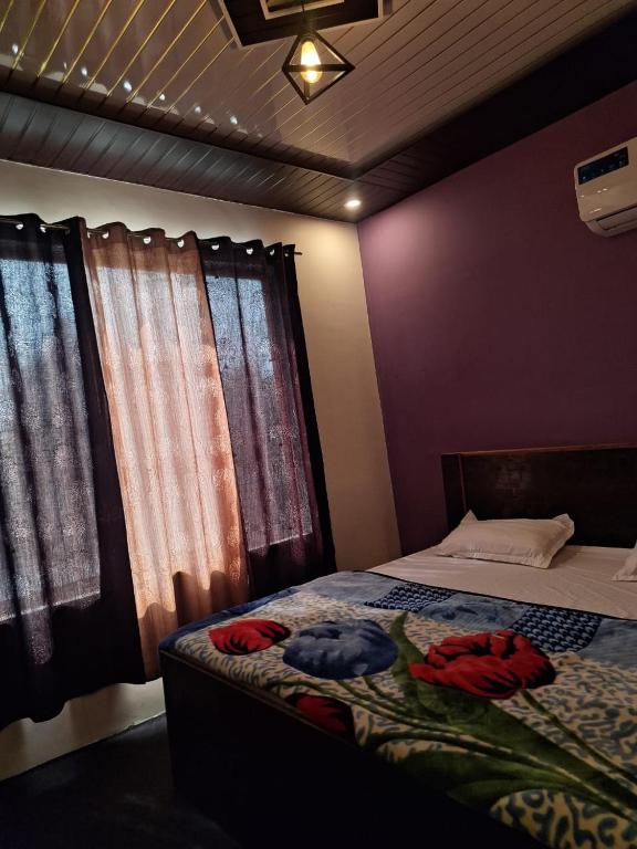 a bedroom with a bed with clothes on it at Privyrooms Raptinagar in Gorakhpur