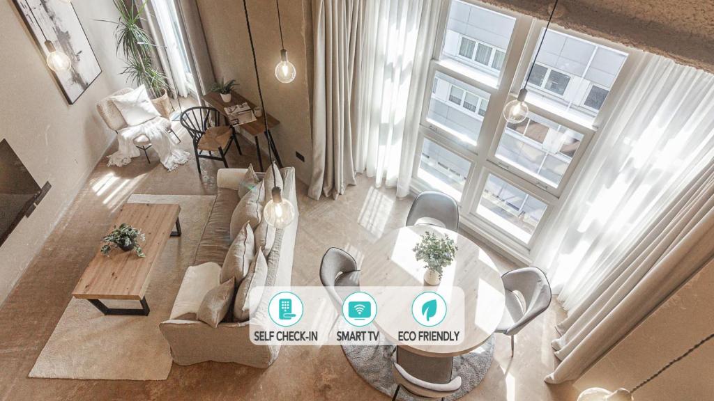 an overhead view of a living room with a table at Metropolitan Boutique in A Coruña