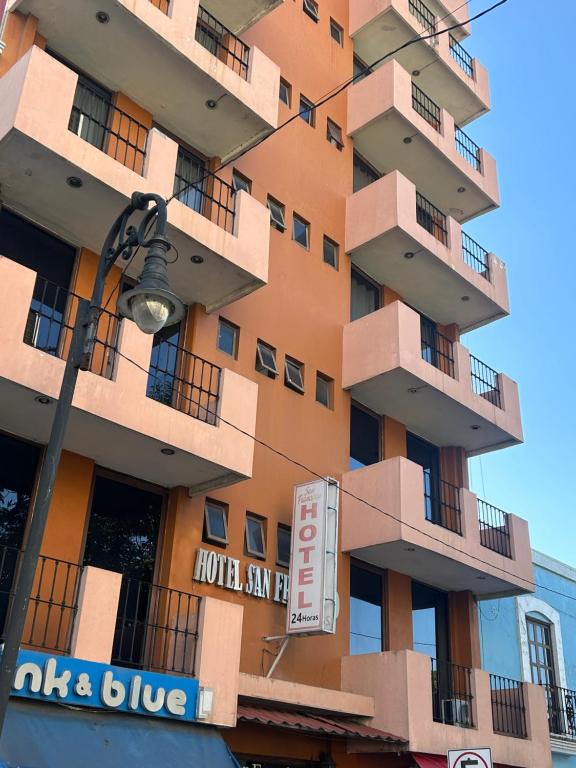 a building with a hotel sign in front of it at Hotel San Francisco in Villahermosa