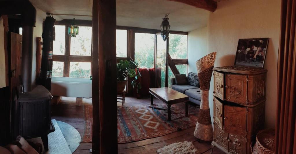 a living room with a tub and a couch and a window at tausend plus eine nacht in Vöhl