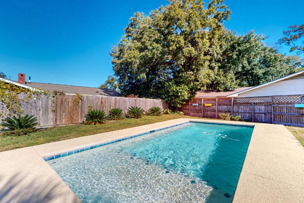 a swimming pool in the backyard of a house at Poolside Bliss! Christian Pass Family Home w/ Yard in Long Beach
