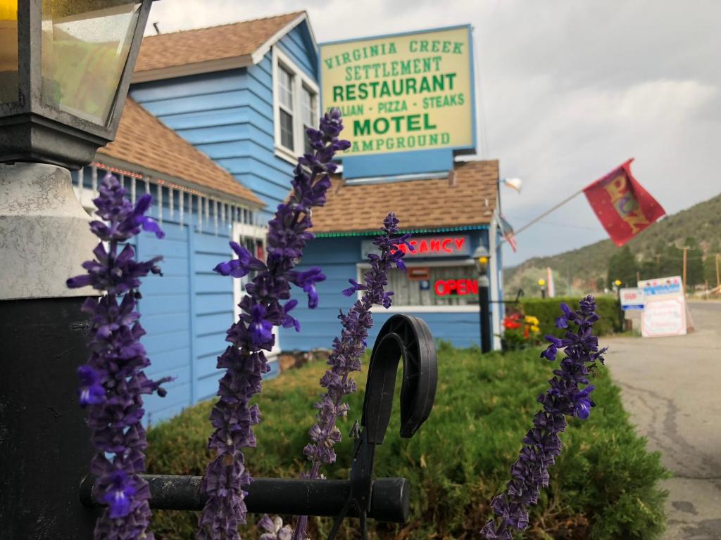 a building with purple flowers in front of it at Virginia Creek Settlement in Bridgeport