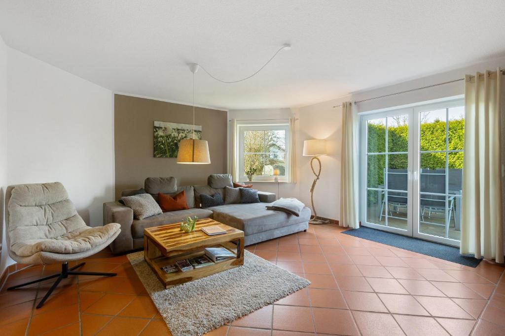 a living room with a couch and a table at Ferienwohnung Dora in Medebach