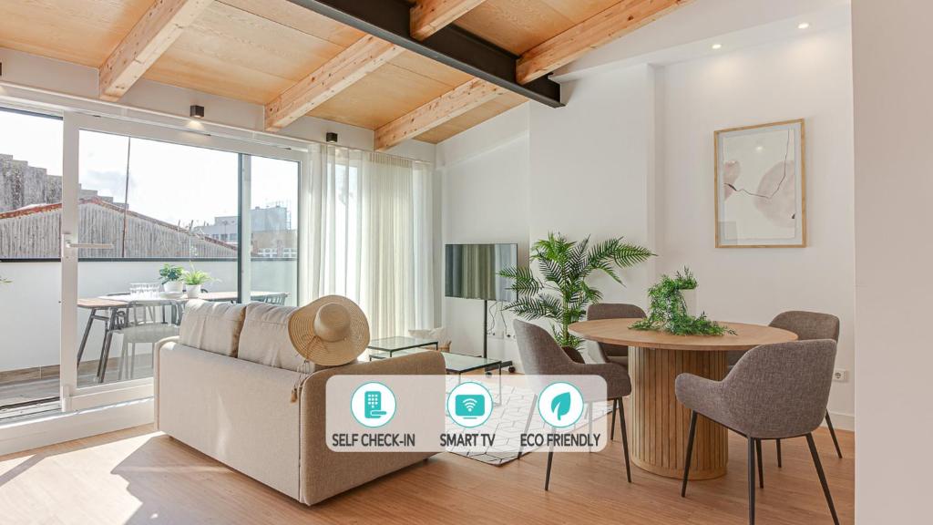 a living room with a couch and a table at Santa Lucía in A Coruña
