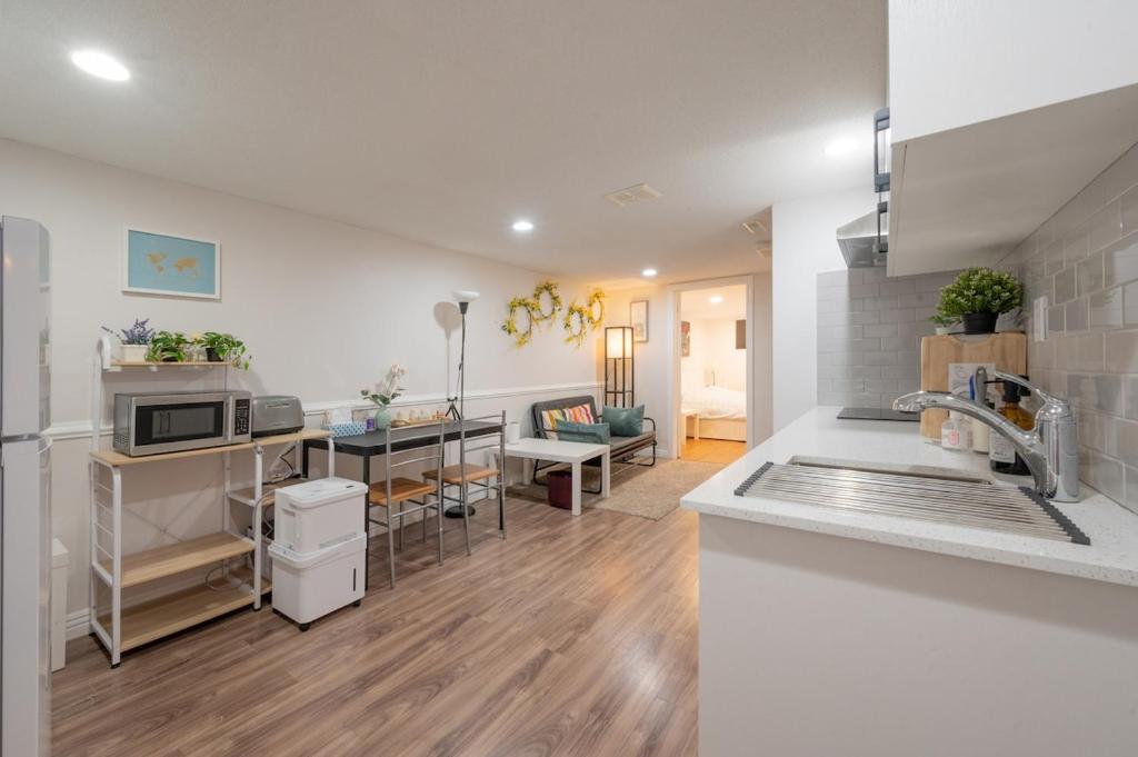a kitchen with a sink and a counter top at Comfy Private Basement- Scarborough in Toronto