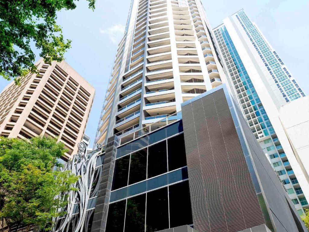 a tall building with two tall buildings at Mantra on Mary in Brisbane