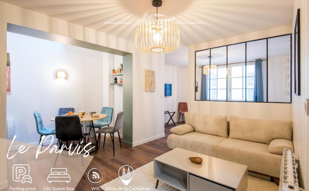 a living room with a couch and a table at Le Parvis in Rodez