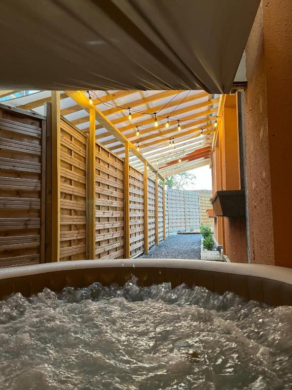 a hot tub with water inside of a building at Agréable maison avec SPA in Crécy-en-Ponthieu
