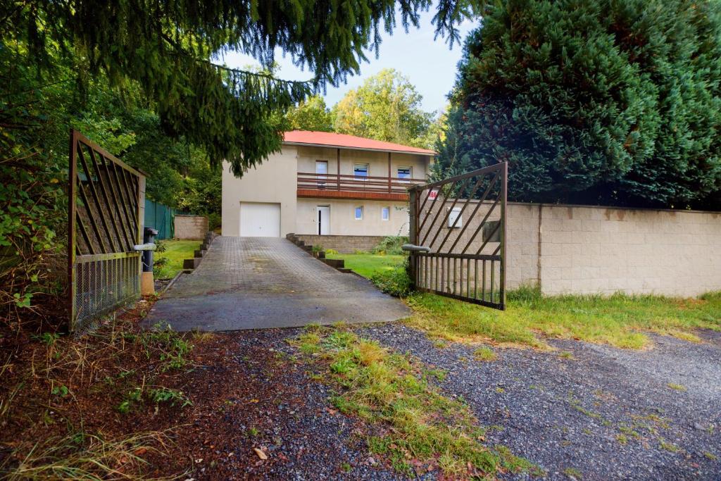 a house with two gates in front of it at Apartmány U BERANA in Česká Lípa