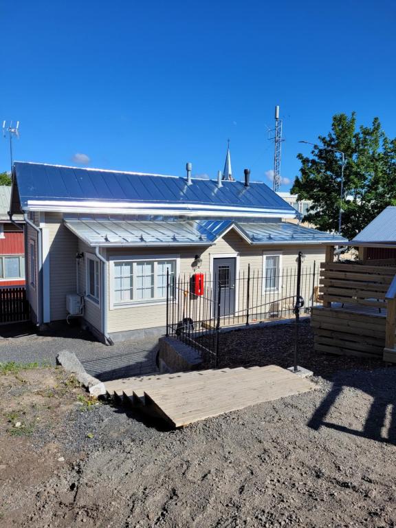 a house with a solar roof on top of it at Majoitus Merihelmi in Kristinestad