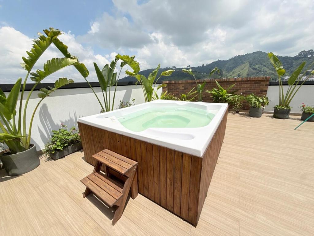 a bath tub sitting on top of a deck at New studio, exceptional location with parking in Santa Rosa de Cabal