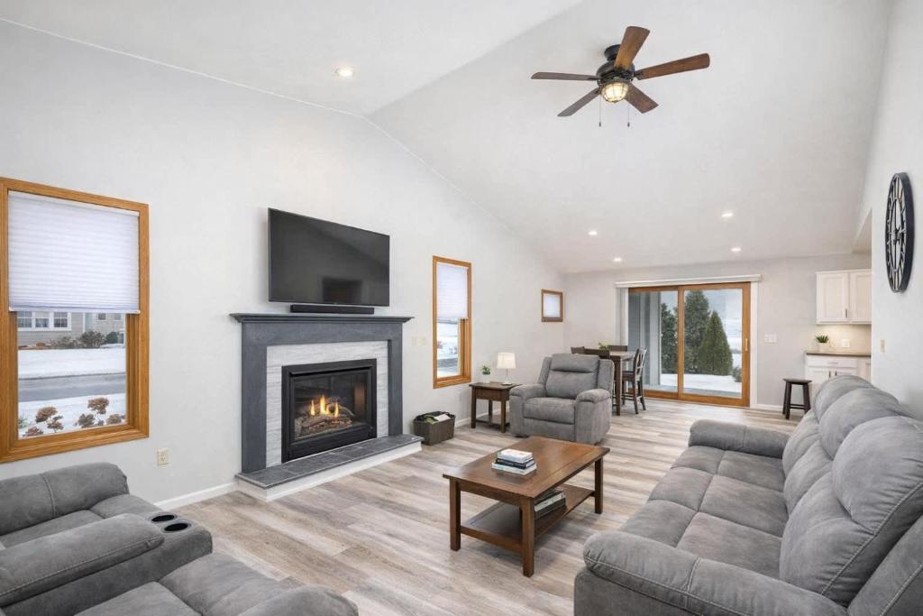 a living room with a couch and a fireplace at East Side 3 Br 2 full bath King Bed in Appleton
