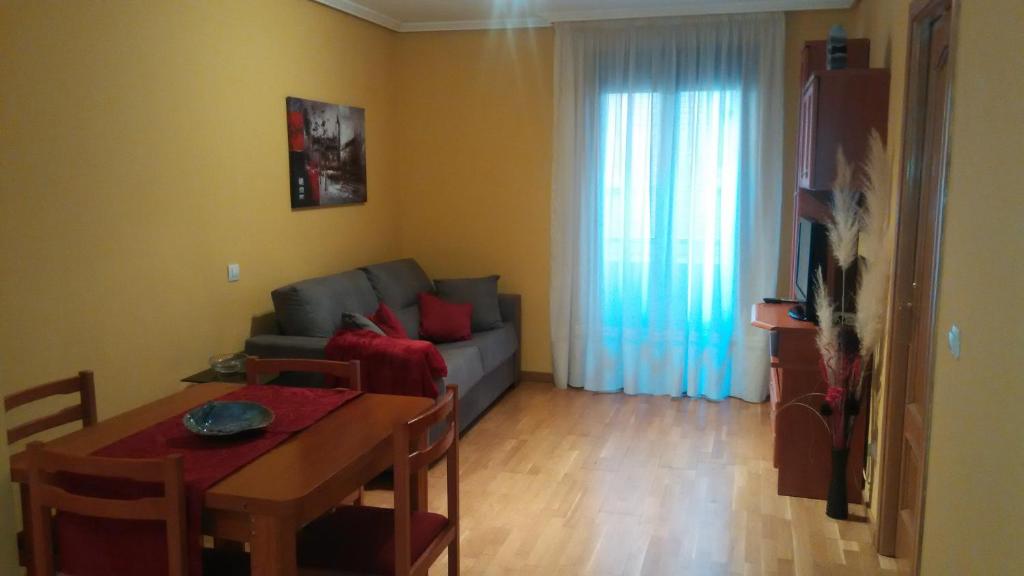 a living room with a couch and a table at Apartamento San Martín in Teruel