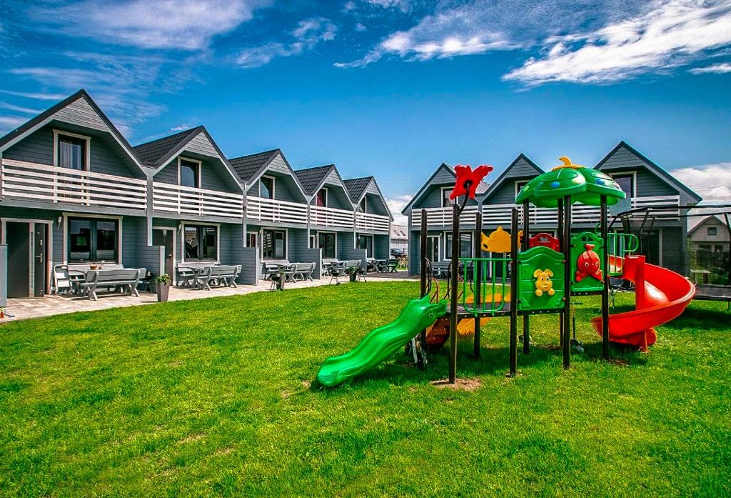 a playground in the yard of a house at Morska Melodia in Sarbinowo