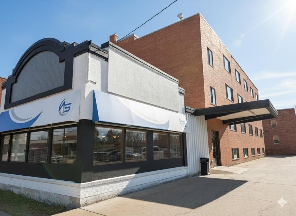 a building with a sign on the side of it at Aisling Suites in Great Falls