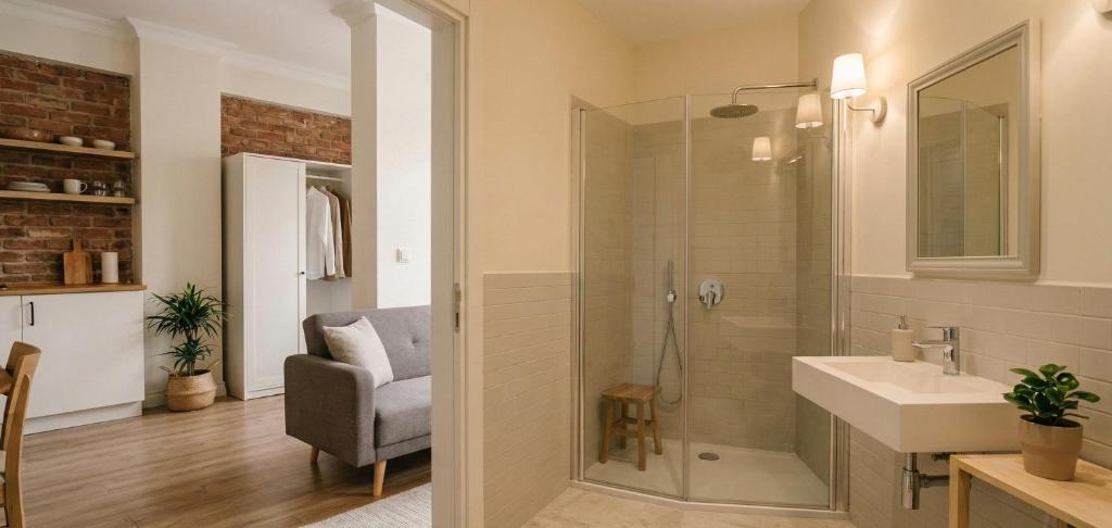 a bathroom with a shower and a sink and a chair at pınar apart hotel in Kapuluören