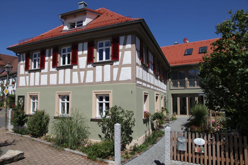 a large building with a red roof at Luisenhof in Geisfeld