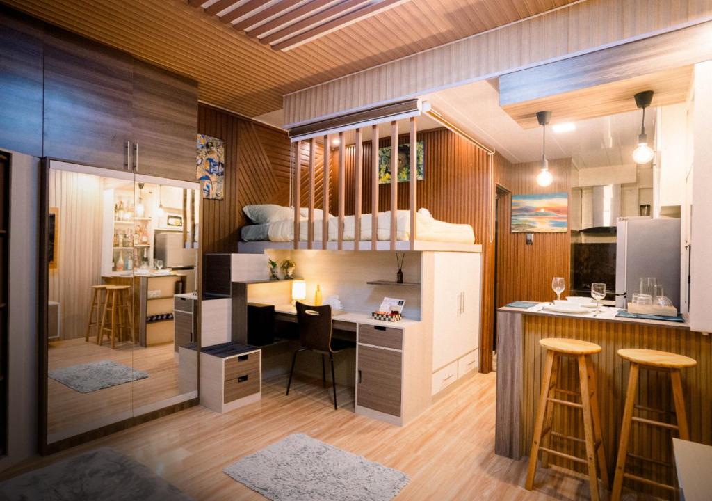 a small room with a bunk bed and a desk at G-Luxe Panabo Guesthouse - Unit A in Panabo