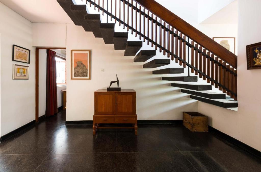 a hallway with a staircase in a house at Flower Road Villa in Colombo