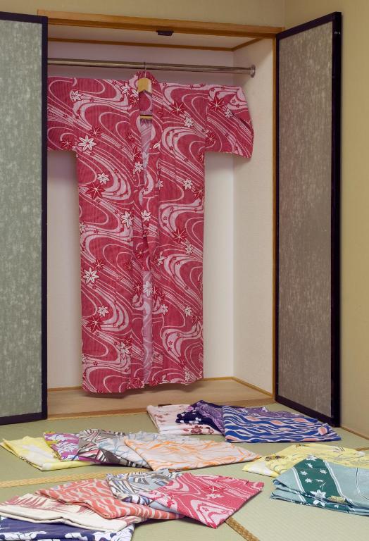 Postel nebo postele na pokoji v ubytování Nikko Senhime Monogatari