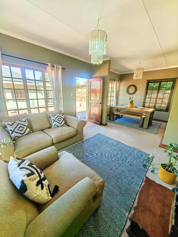 a living room with a couch and a table at Meya B in Harrismith