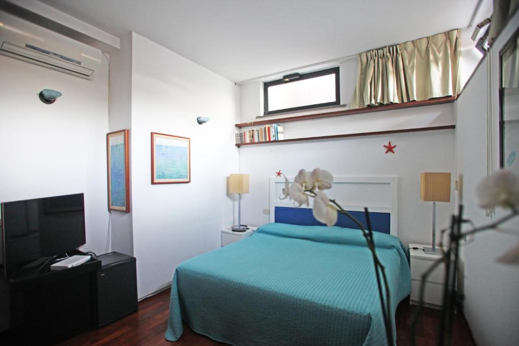 TV a/nebo společenská místnost v ubytování Residenza L'Isola Capri