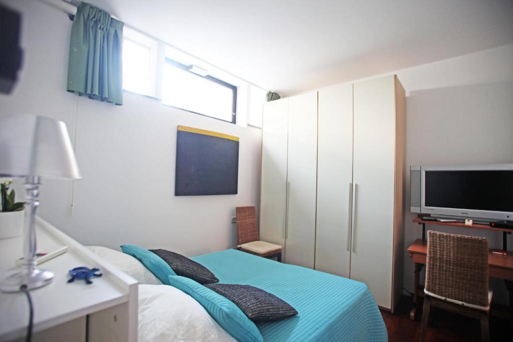 TV a/nebo společenská místnost v ubytování Residenza L'Isola Capri