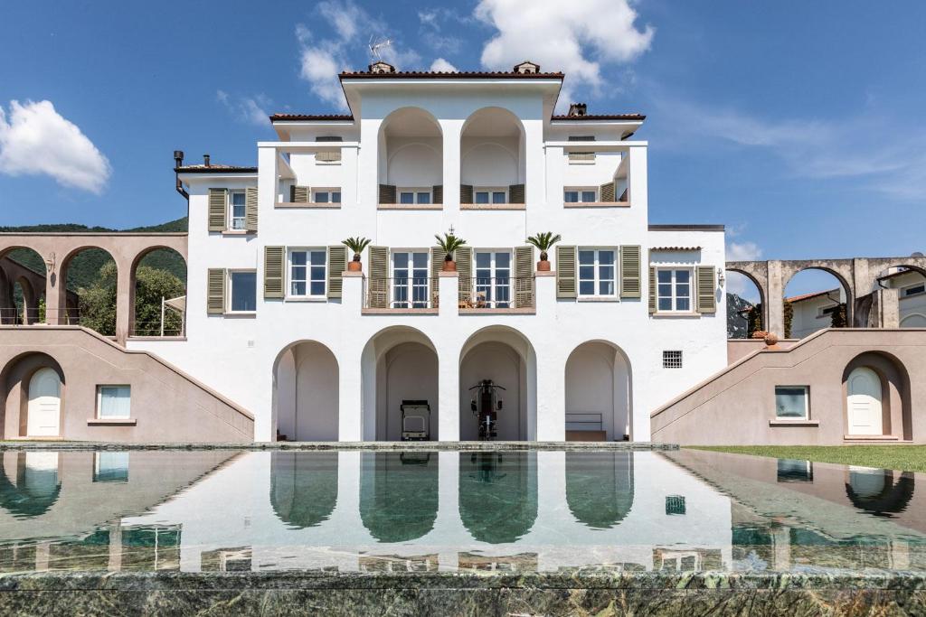 a house with a pool in front of it at Le Selve Lake View Villas in Toscolano Maderno
