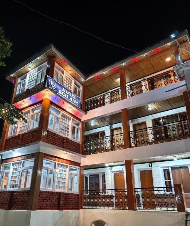 a building with balconies on the side of it at Hotel Ech Aar, Kargil in Kargil