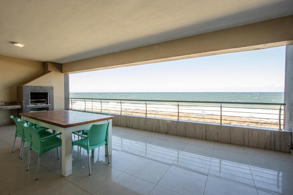 a dining room with a view of the beach at Saints View Resort Unit 16 in Uvongo Beach