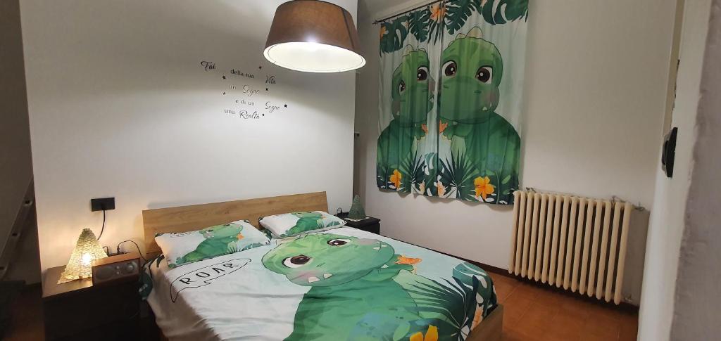 a bedroom with a dinosaur bed with a painting on the wall at The SISTERS in Castel Maggiore