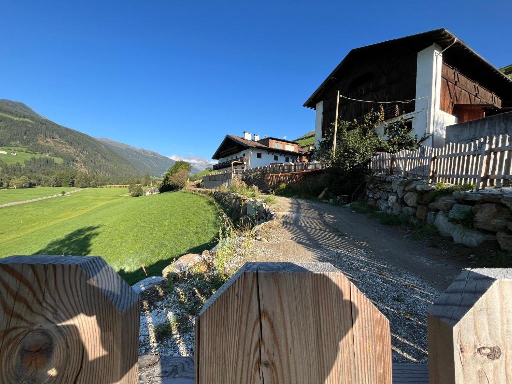 a wooden fence in front of a house at Wolter Landhaus in Vipiteno