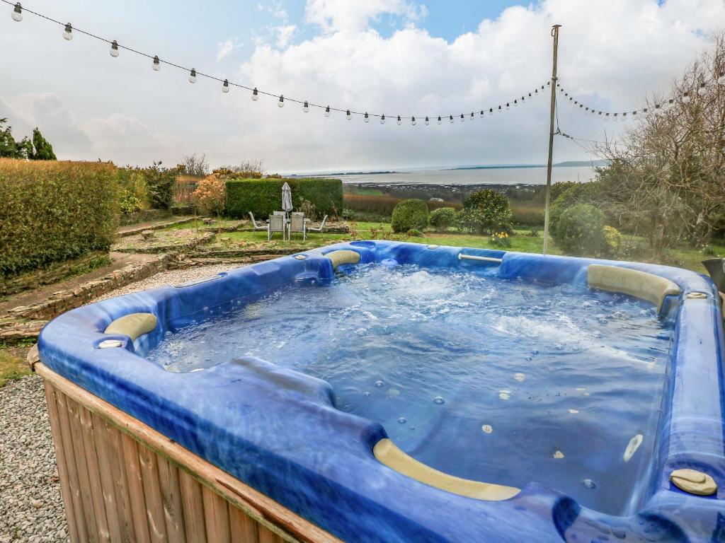 a large blue pool of water in a yard at Burry House in Swansea
