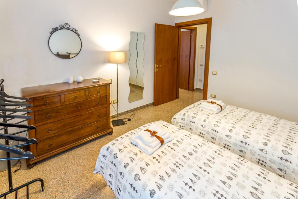 Postel nebo postele na pokoji v ubytování Buon Vento