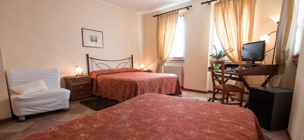 Postel nebo postele na pokoji v ubytování Hotel Aquadolce